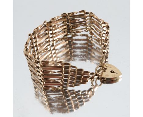 A 9ct gold seven bar gate bracelet, with padlock clasp, weight 14.3g