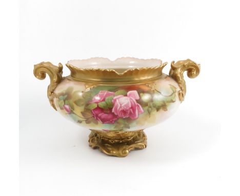 A Royal Worcester centre piece, with shaped edge, gilt scroll handles, the body decorated with roses and leaves by F Harper, 