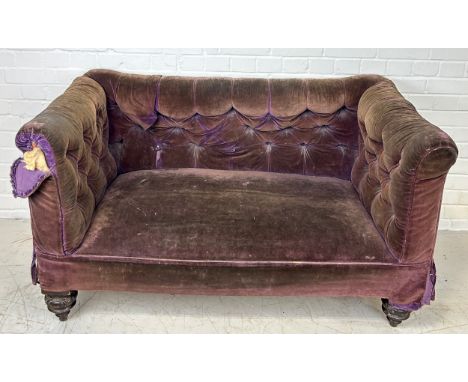 A VICTORIAN OR WILLIAM IV SOFA CHESTERFIELD BUTTON BACK SOFA UPHOLSTERED IN ANTIQUE PURPLE VELVET UPHOLSTERY, Raised on four 