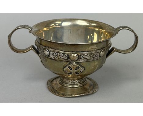 AN EDWARDIAN ARTS AND CRAFTS SILVER CUP WITH CELTIC KNOTS MARKED FOR WAKELY AND WHEELER, Weight: 114gms 11cm x 5.5cm 