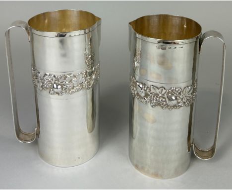 A PAIR OF ITALIAN 925 STERLING SILVER 'HANNES' JUGS WITH REPOUSSE FLORAL AND FAUNA BANDING, Total weight: 1018gms22cm H each.