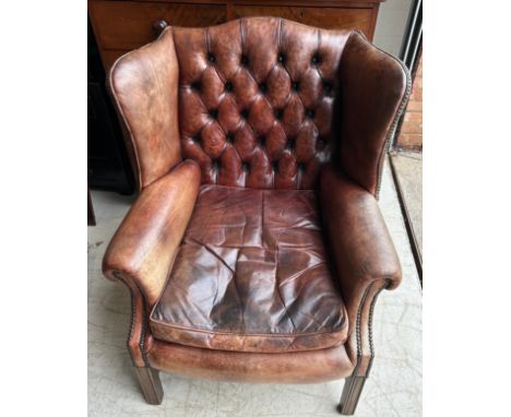 A LARGE CHESTERFIELD BUTTON BACK HAND DYED BROWN LEATHER QUEEN ANNE DESIGN WING BACK ARMCHAIR, 20th Century. 103cm x 80cm x 7