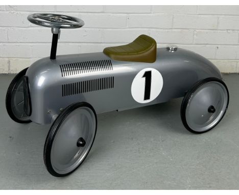 A TODDLER'S TOY MODEL OF A CLASSIC RACING CAR,With wheels, leather set and steering wheel.75cm in length.