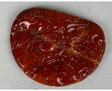 A CHINESE AMBER NETSUKE, 7cm x 5.5cm Old repairs throughout. Collection label to verso 'Old Chinese Amber'. 