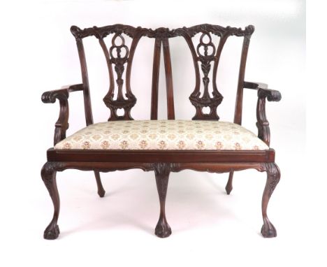 A doll's reproduction Chippendale style foliate carved mahogany two seat settee, with pierced splats, drop-in seat, on cabrio