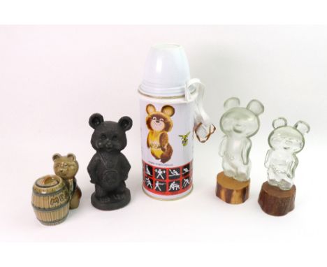 A 1980 Moscow 1980 Olympic Commemorative Thermos flask, two Misha Bear glass bottles, a patinated metal standing figure, a ce