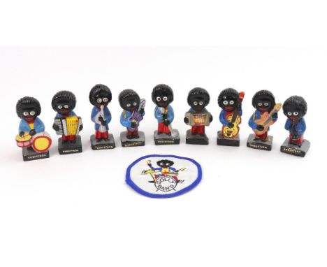 A painted plaster Robertsons Golly nine-piece band, and a Golly band patch (10).