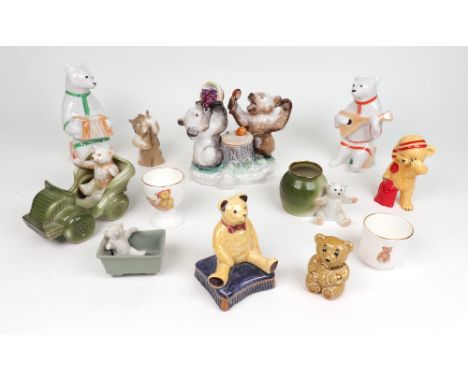 A German porcelain inkwell, modelled as two squabbling bear cubs, and two Russia porcelain bear figures, two bear fairings, a