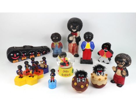 An ECL Plastic Products standing Golliwogg money box, 20cms, a standing Golliwogg rubber toy unmarked, 18cms, a "Jolly Golliw