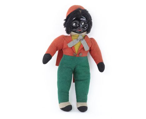 A vintage Golliwogg doll circa 1920's, painted pressed celluloid face with open/close googly eyes and painted features, in a 