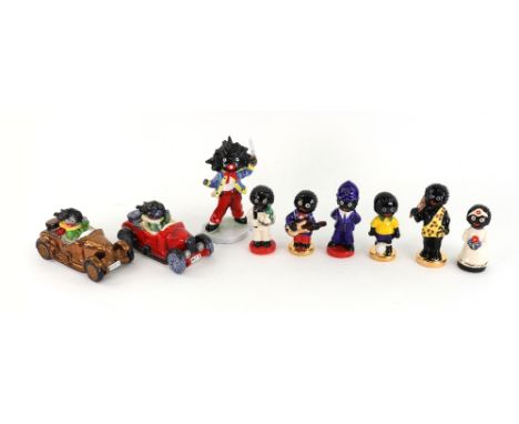 A Carlton Ware bone china figure Golliwogg racing car, 80/50, 12cm, another trial colour, another Golliwogg with cutlas numbe