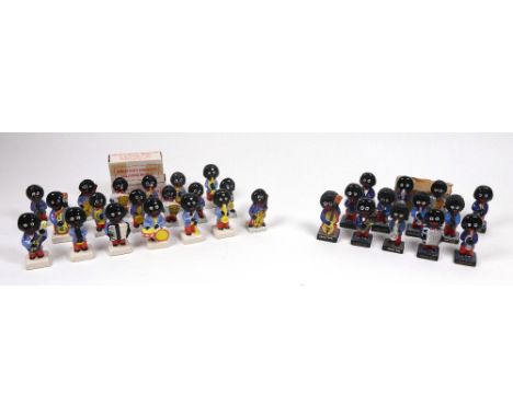 Eight Carlton Ware slip cast Golliwogg band figures and an advertising panel, four painted chalk figures, marked Robertsons, 