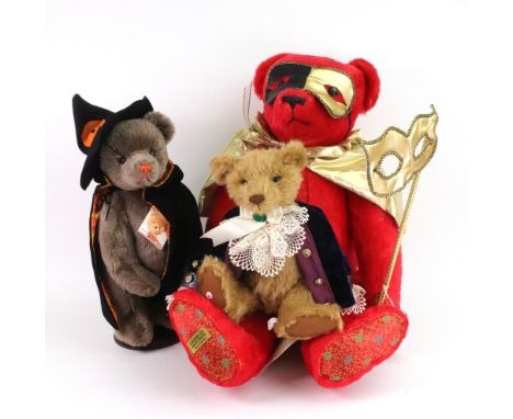 A large red Merrythought Masquerade Bear, wearing a gold cape and holding a mask, 55cm, a Herman 'Halloween' Teddy bear, 34cm