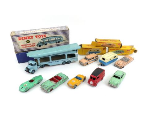 Dinky Toys 131 Cadillac Tower, 173 Nash Rambler, 190 Caravan and 982 Pullmore Car Transporter, all boxed, four Dinky Toys car