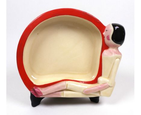 An A J Wilkinson Clarice Cliff Joan Shorter Kiddies Ware baby bowl, the rim moulded with a seated Dutch doll, printed marks, 