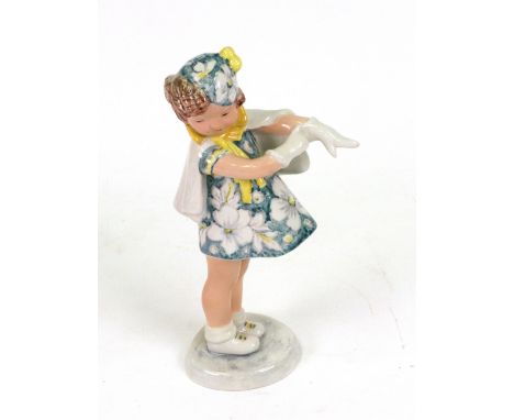 A similar Myott Son & Co Staffordshire figure of just the young girl wearing a floral dress and yellow ribboned cape, printed