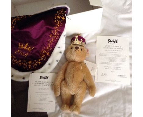 A modern Steiff Queen Elizabeth II Coronation Teddy Bear, complete with robe and crown, 29cm, with certificate, original box 