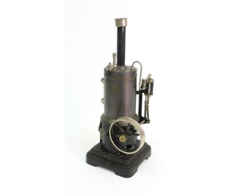 A Marklin Germany metal model toy vertical steam engine, in Marklin wooden case with sliding cover.