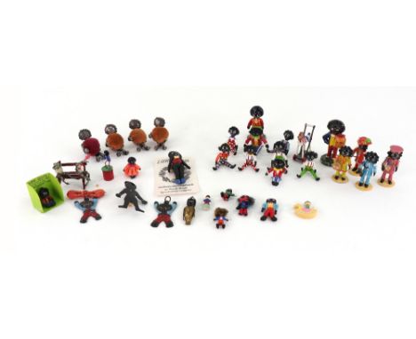 Ten hand painted cast pewter Golliwogg figures, four plated seated Golliwogg pin cushion figures, and other miniature Golliwo