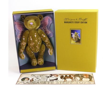 A modern Steiff Fairytales Bear, 186/500, 36cm, with original book and box, and a Margaret Steiff Toys sign, printed with bea