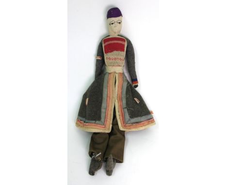 A vintage dressed doll from Buenos Aires, 50cm tall.