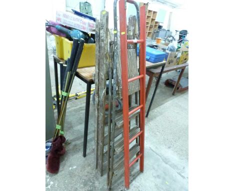 Two vintage stepladders and a further red wooden ladder (3)