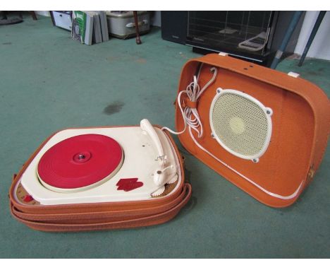 A vintage portable record player with speaker lid
