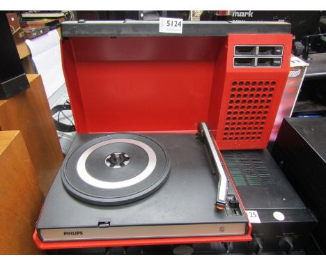 A vintage Philips portable record player in red