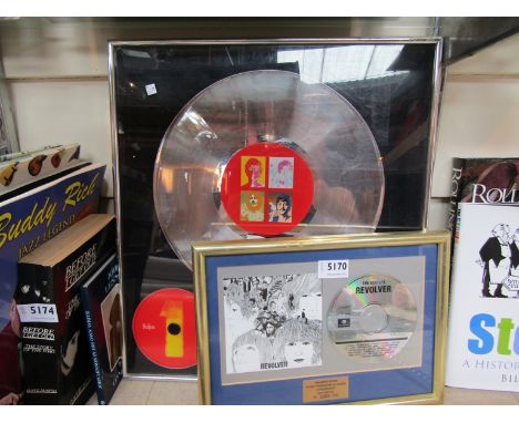 A framed 'Beatles 1' CD/LP presentation and 'Revolver' CD presentation