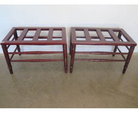 A pair of Edwardian luggage stands in a mahogany stained finish with ring turned legs and stretchers height 44cm x width 70cm