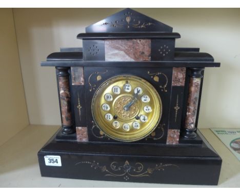 A black slate striking architectural clock - Height 30 cm x Width 34 cm