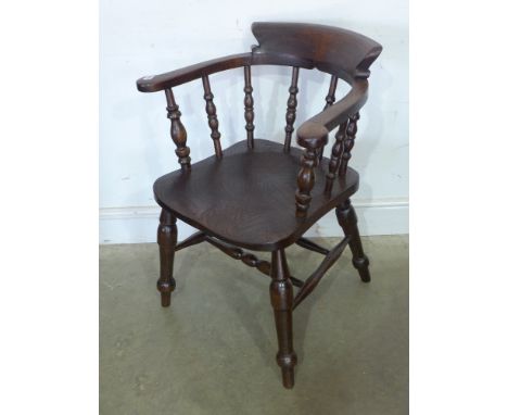 An elm smokers bow armchair 