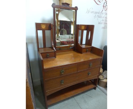 A good quality Arts and Crafts inlaid walnut dressing chest with two trinket drawers above three drawers and a shelf - Height