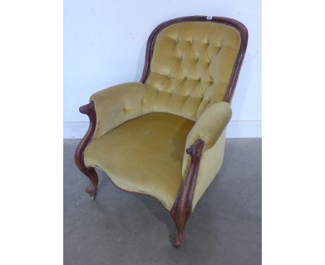 A Victorian mahogany button back scroll armchair