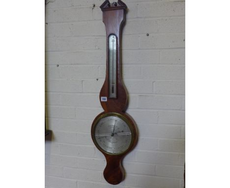 A 19th century mahogany wheel barometer with a thermometer the silvered dial signed TORRE and CO LONDON - Height 96 cm 
Condi