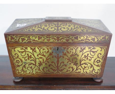 A good Regency brass inlaid sarcophagus shaped two section tea caddy 
Condition report: With replacement mixing bowl