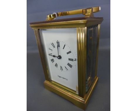 A modern Mappin & Webb carriage clock/timepiece - glazed all sides and top signed white enamel face 
Condition report: In run