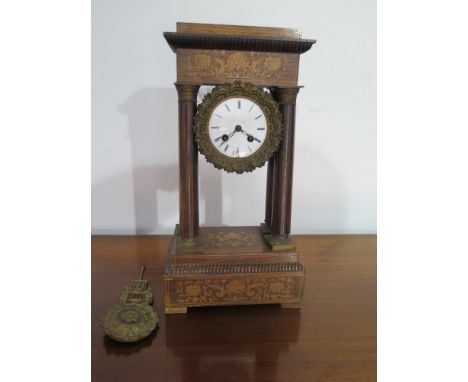 A 19th century French inlaid rosewood Portico clock - the columns with brass foot and cap inlaid with boxwood stringing - the