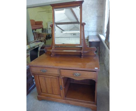 A late Victorian marble top walnut washstand with a tile back above two drawers, a cupboard and cubby hole - Height 1.17 m x 