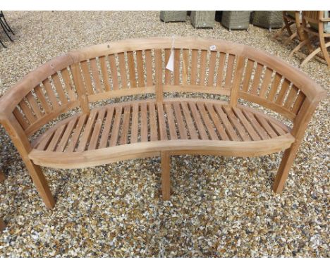A Bramblecrest teak banana bench
Condition report: Damaged to top 