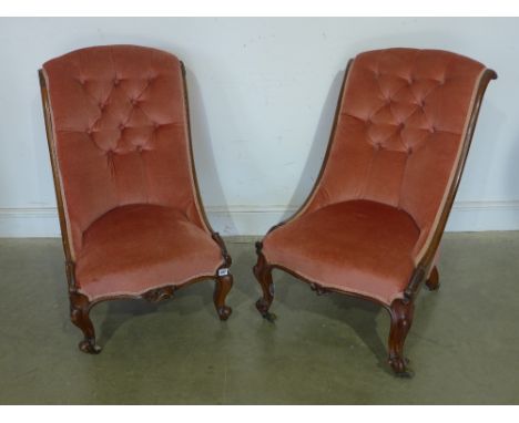 A near pair of 19th century button back mahogany nursing chairs 