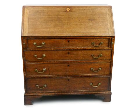 A George III oak bureau, the mahogany cross-banded fall front opening to reveal a fitted interior with central satinwood and 