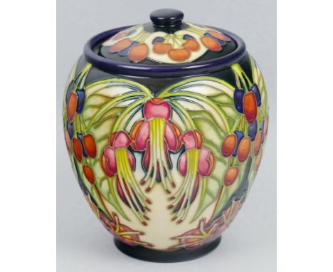 A Moorcroft jar and cover, of bulbous form with inset lid, tube lined in the 'Piri Tree' pattern by Phillip Gibson, 15cm high