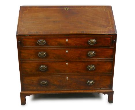 A George III mahogany bureau, the inlaid and cross-banded fall front opening to reveal a fitted baise lined interior with a c