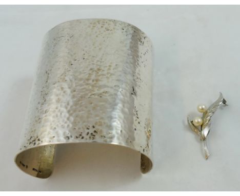 M & J Savitt - an American silver cuff bracelet, of textured form and a sterling silver brooch set with cultured pearls (2). 