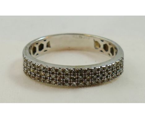 A 9ct white gold half eternity ring, claw set with three rows of single cut stones, total weight approximately  0.50 cts, siz
