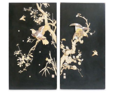 A pair of Japanese Meiji period black lacquer and shibayama panels, of unframed oblong form worked in high relief with carved