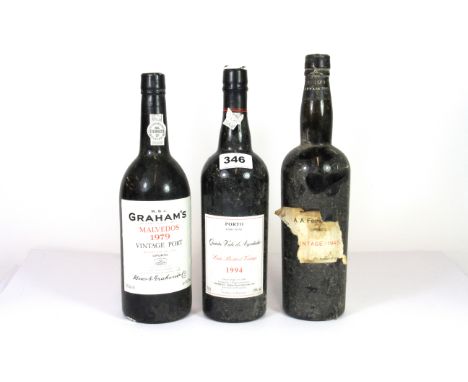 Three bottles of vintage port.