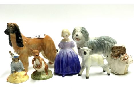 A Beswick dog together with Doulton and other figures.