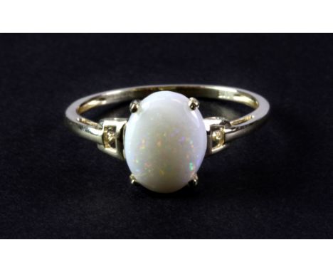 A 9ct yellow gold ring set with a solitaire opal. (Q)